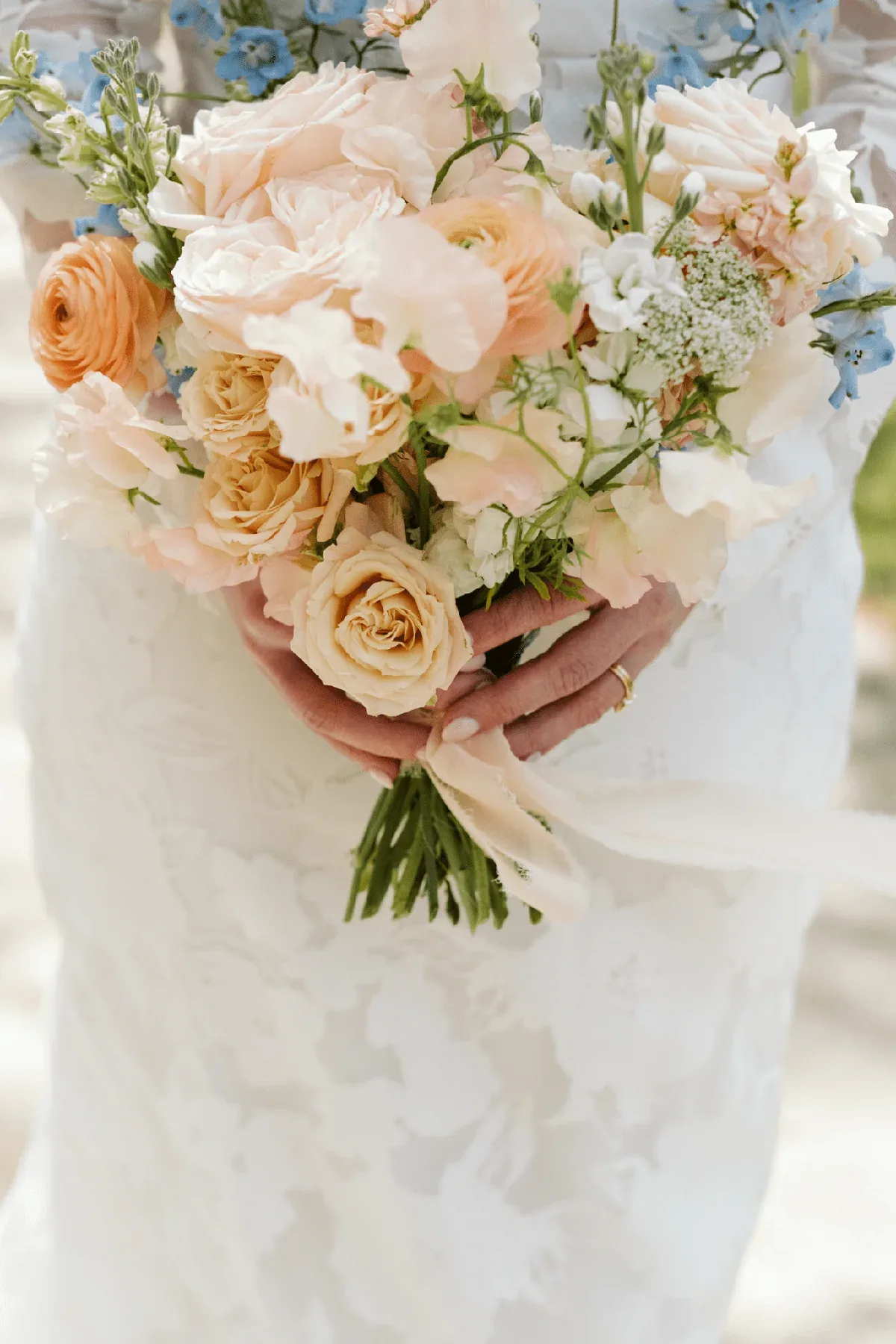 Layered, textural wedding arrangement with movement